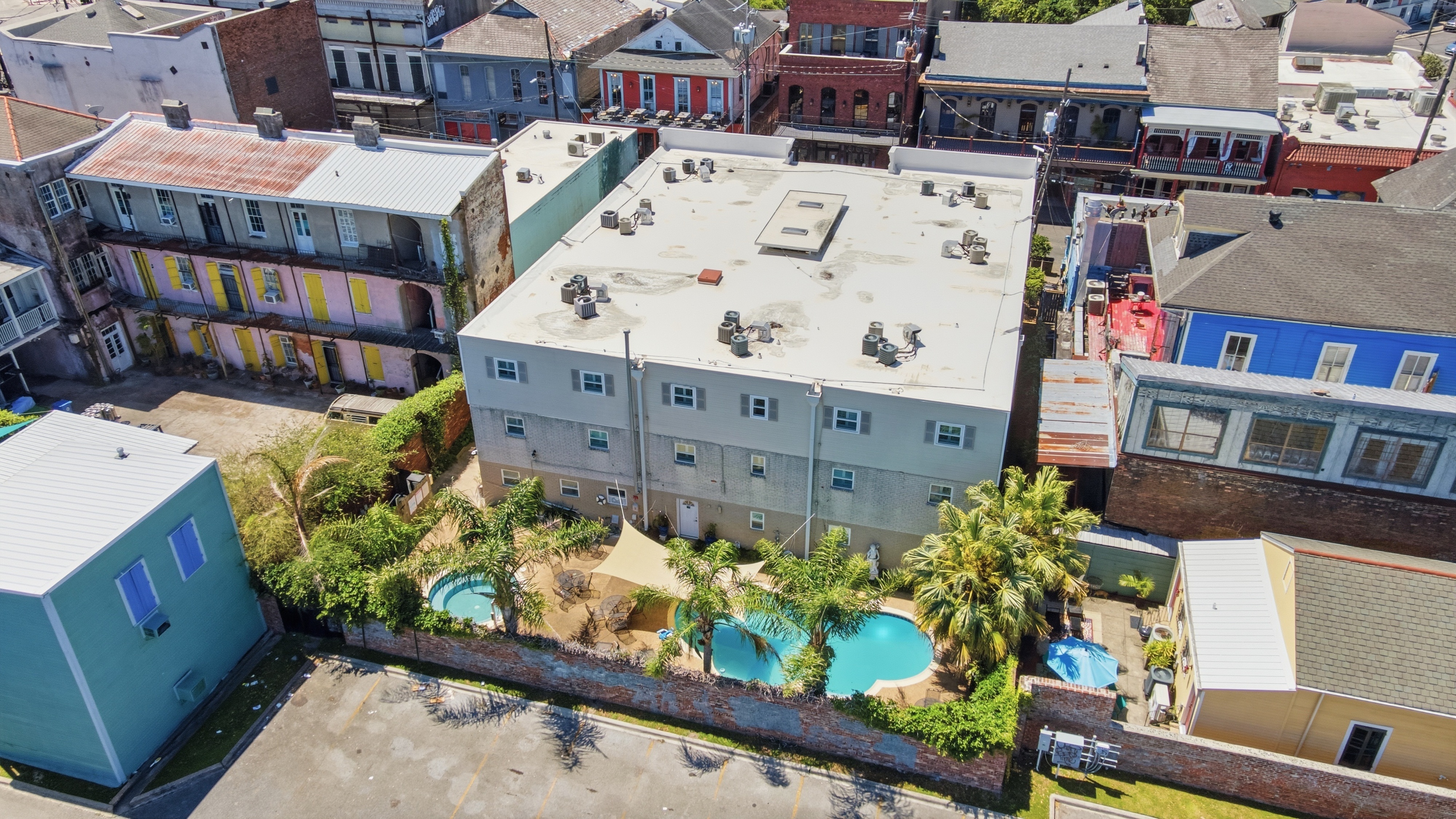 City vibes up front, resort vibes out back (pool + hot tub)
