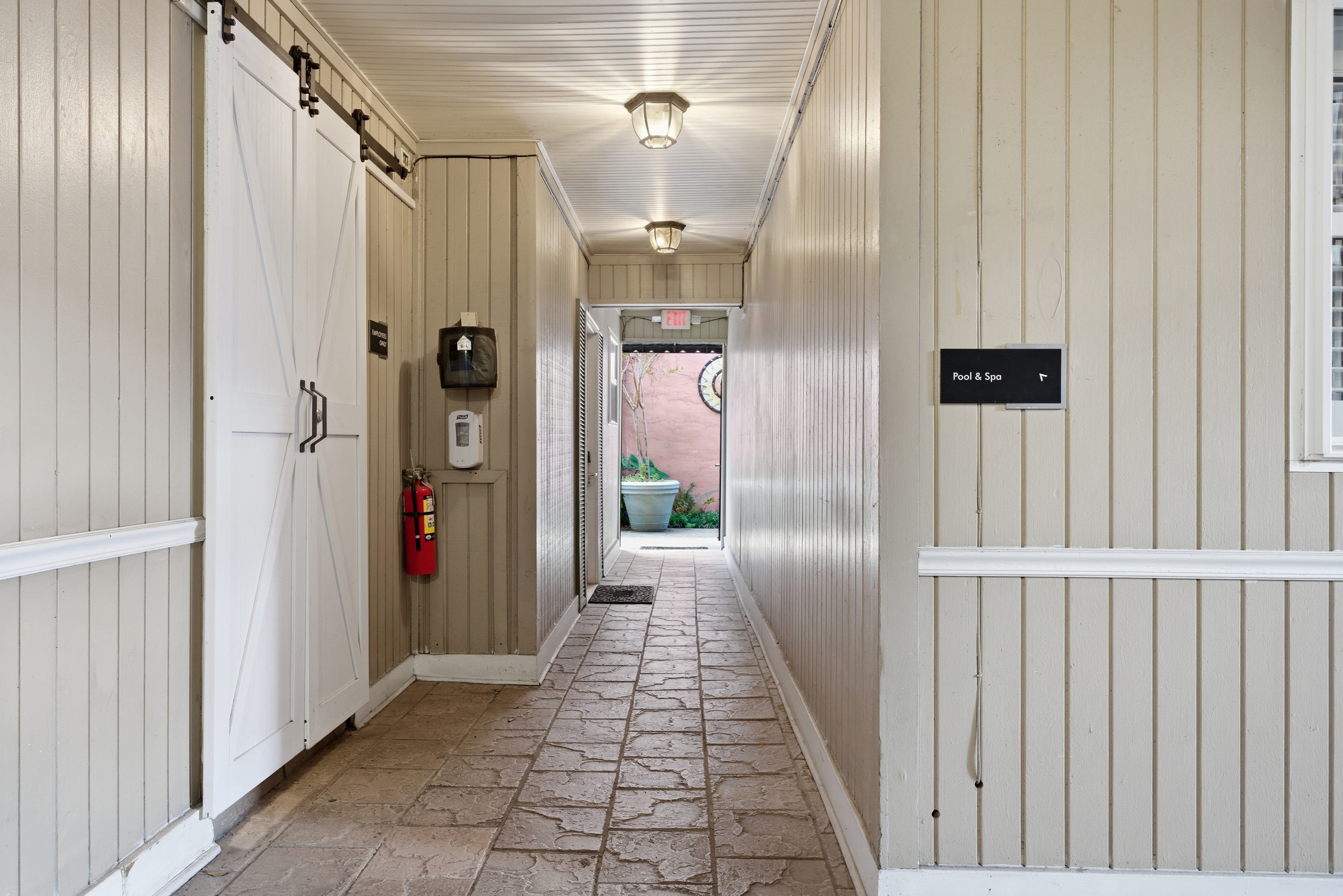 Simple hallway with direct access to shared pool and hot tub