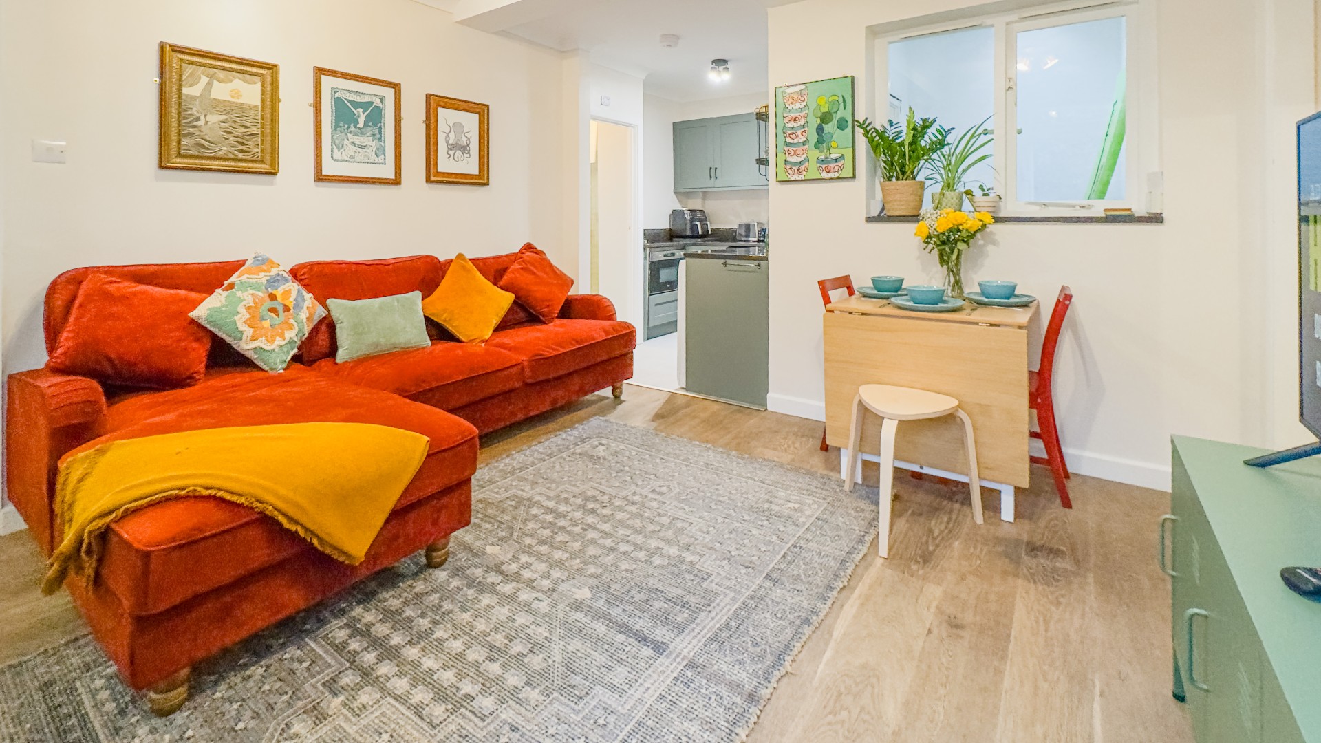 Bright and inviting open-plan lounge with comfortable seating, perfect for relaxing after a day out.