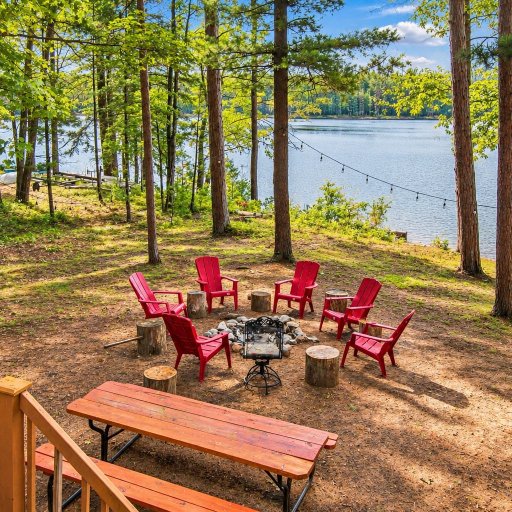 The view from the deck down to the fire pit and the lake