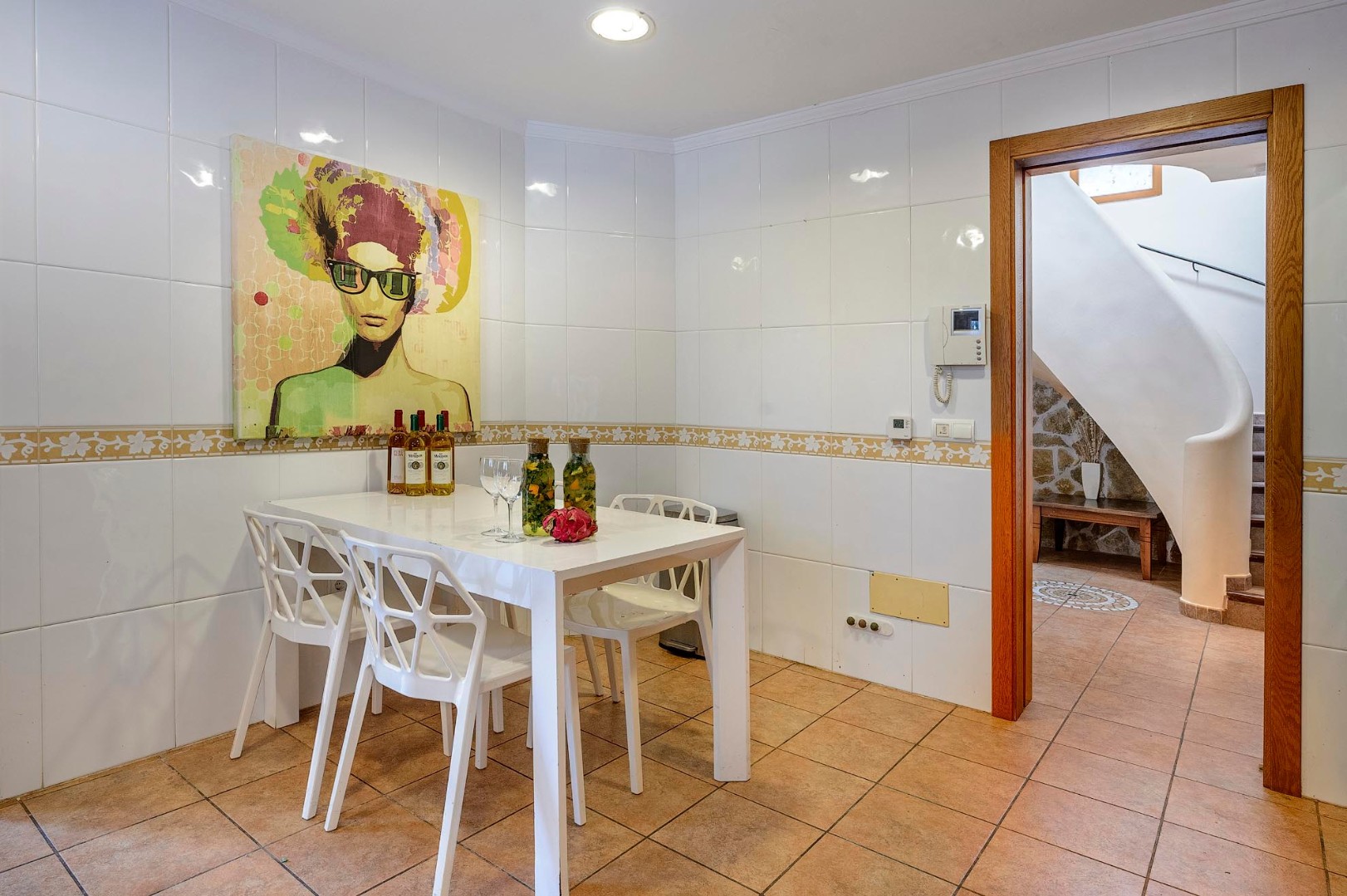 Morning coffee spot. Dining nook off the kitchen with the staircase beyond, Villa Mika, Ibiza.