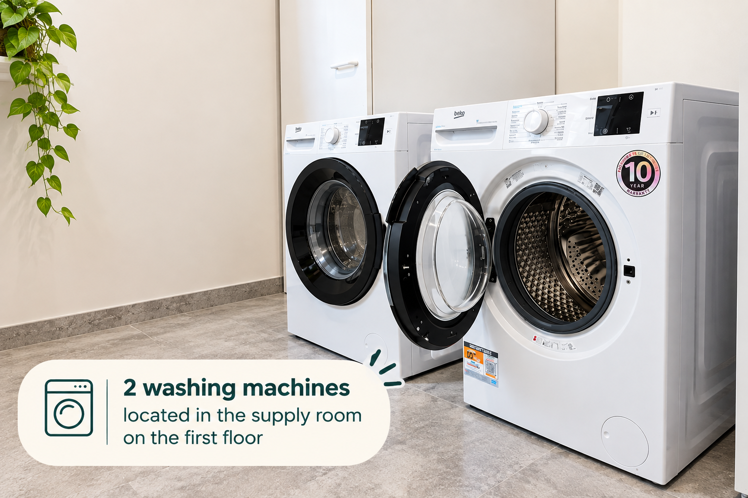 Guest laundry area with 2 washing machines.