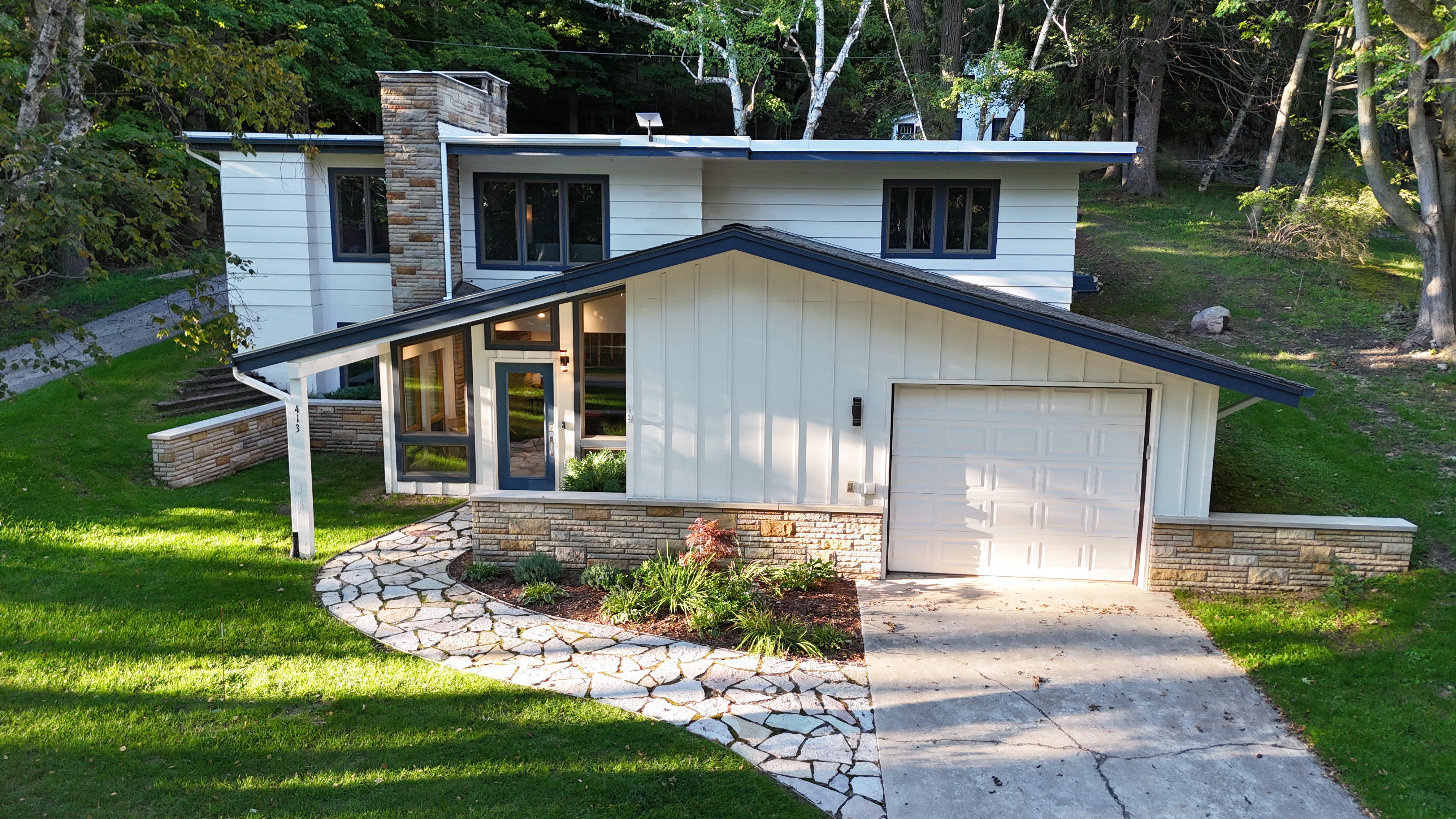 OVERVIEW:  The front of the house in the summer.