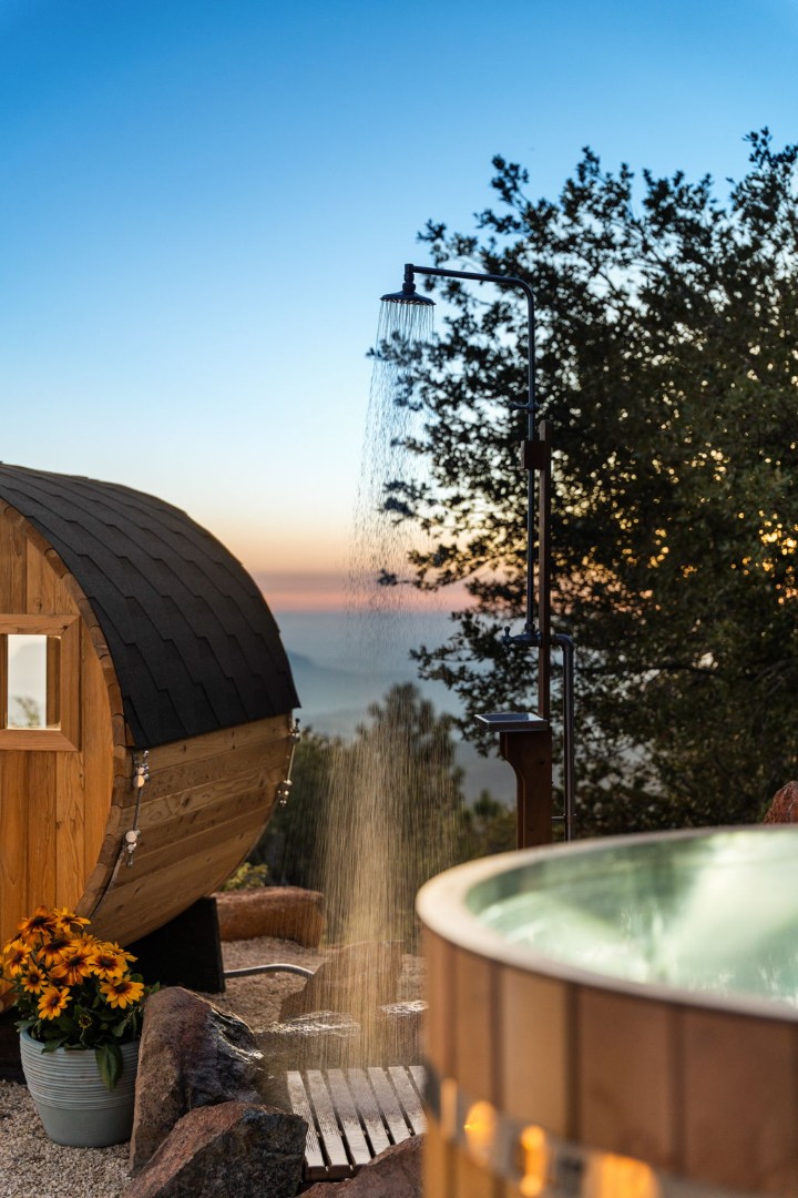 Outdoor shower beside the sauna and barrel cold plunge at Restore Outpost