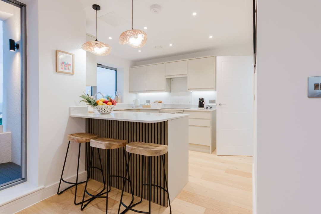 Contemporary kitchen with breakfast-bar seating.