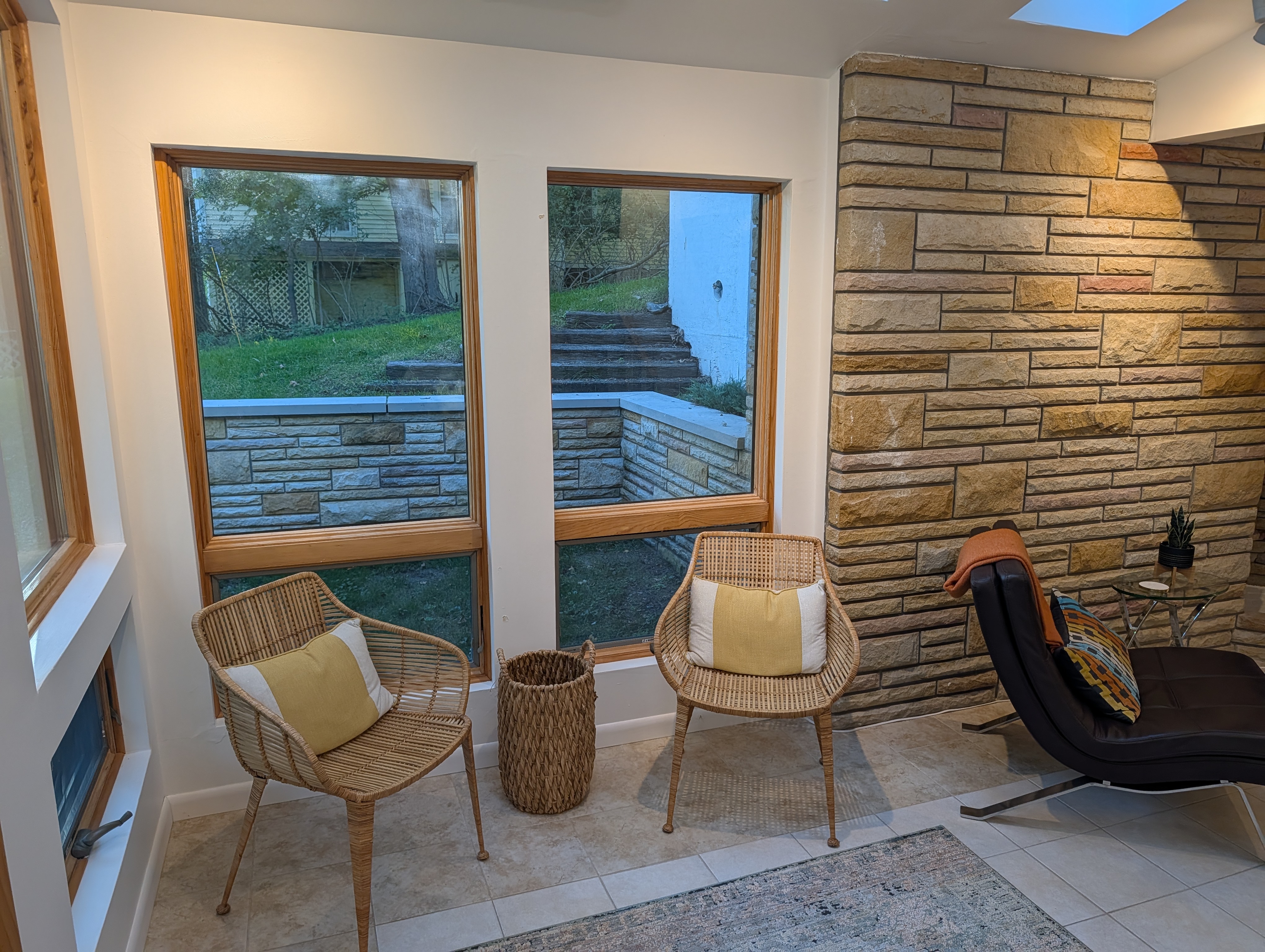 LIVING ROOM #1 (FIRST FLOOR):  Features a sofa, chairs, and large screen televison.