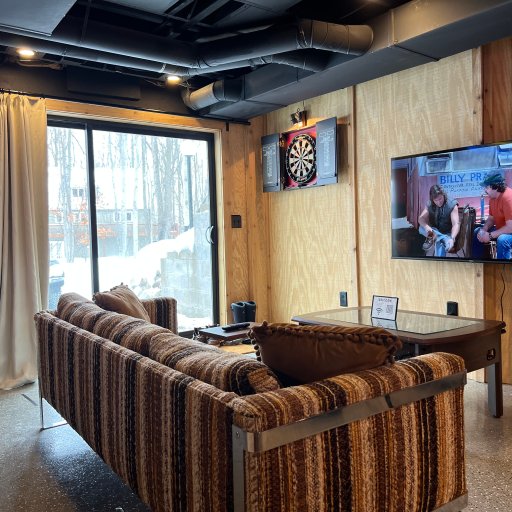 Game room with dartboard and entertainment for all ages