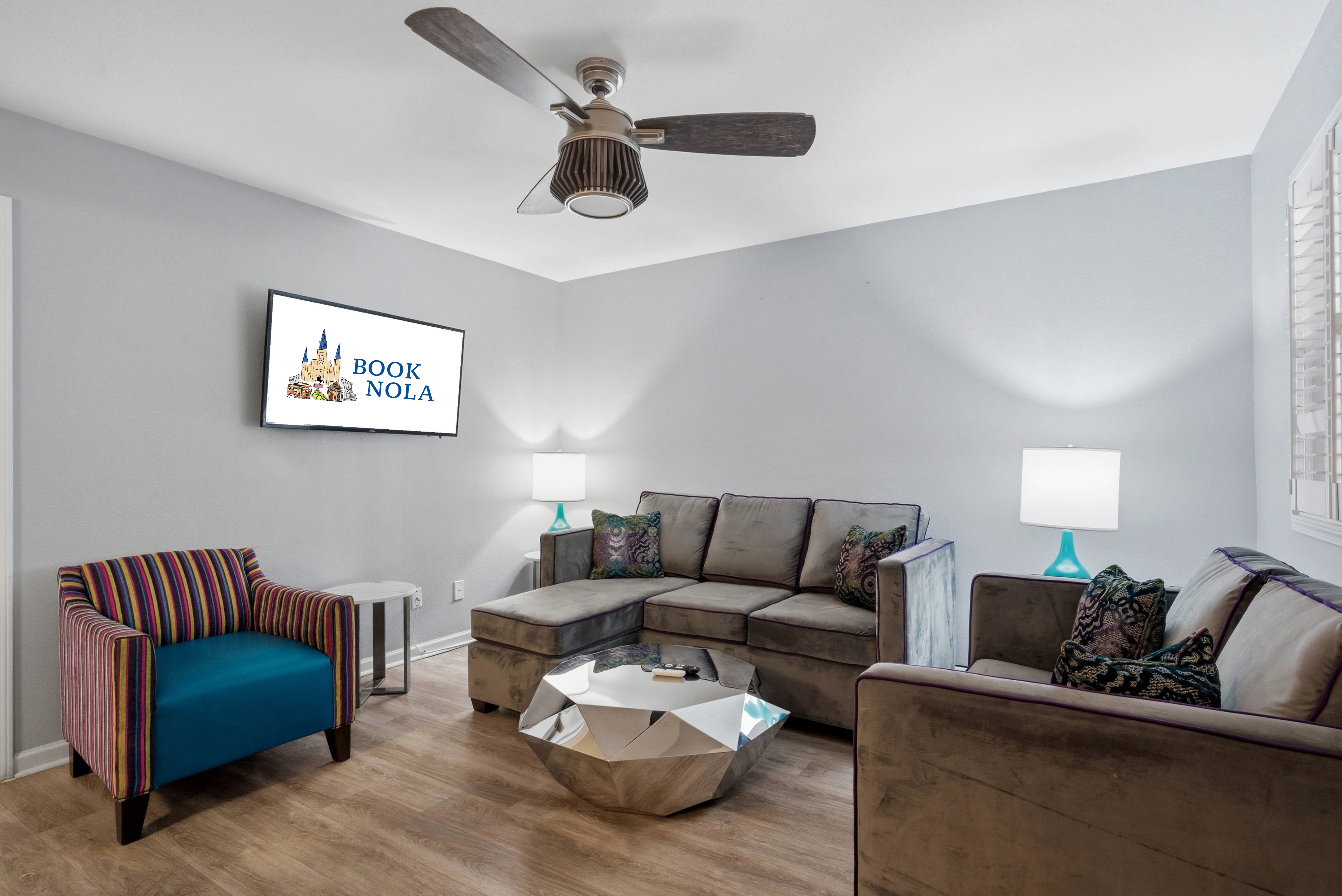 Welcoming lounge with a warm, modern feel and smart TV