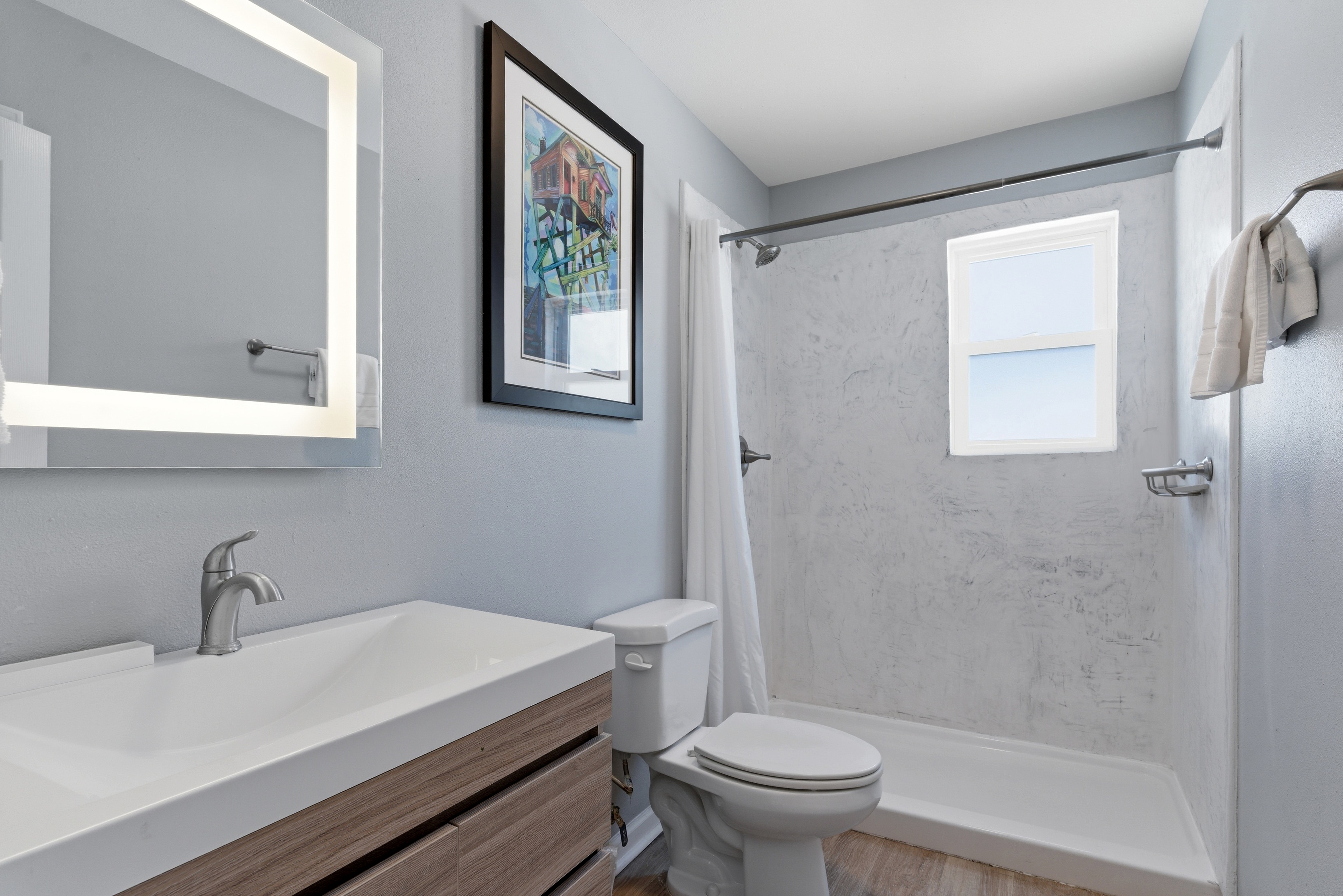 Fresh bathroom space stocked with essentials to refresh & unwind