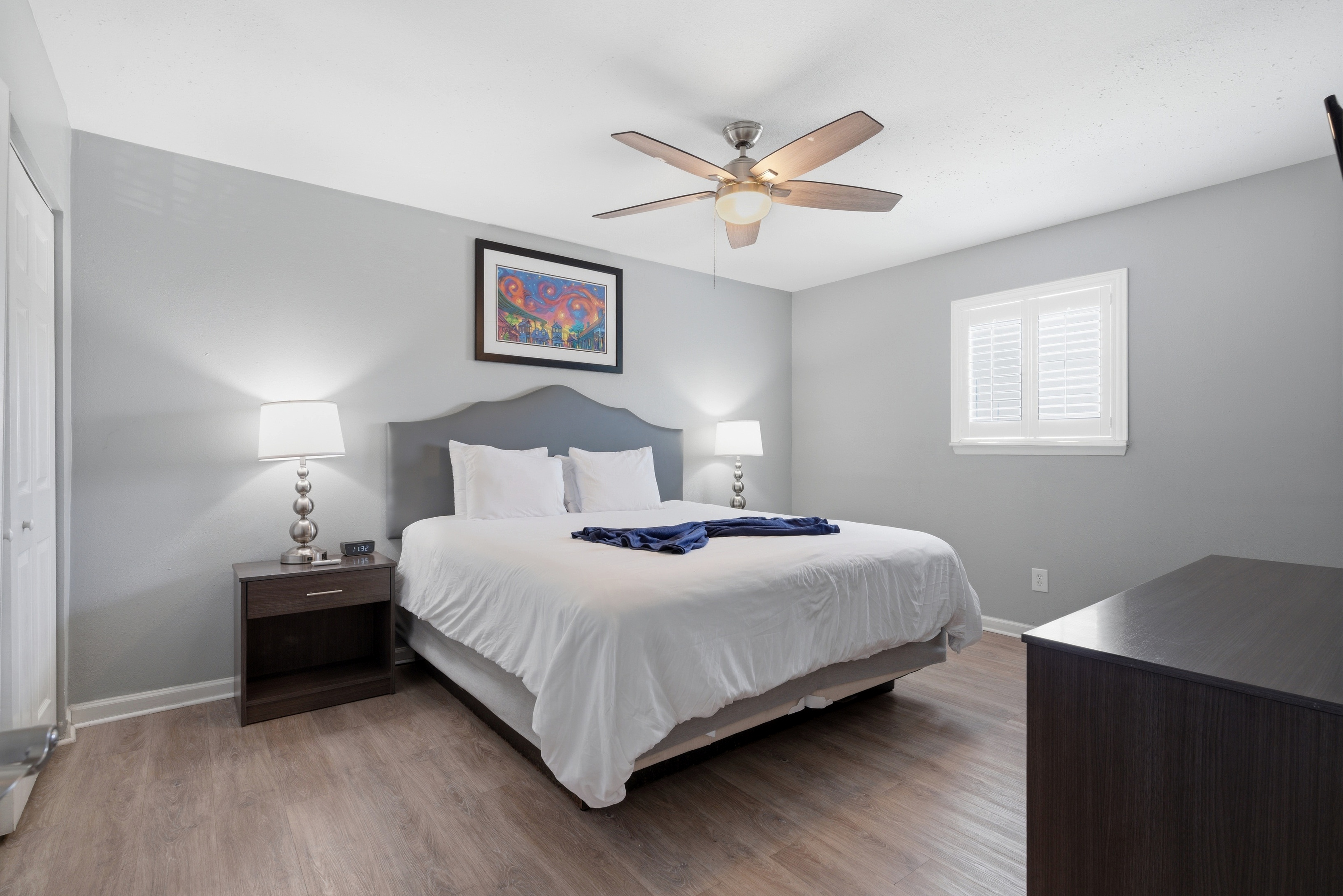 Unit 303-Serene primary bedroom with a king bed designed for restful nights