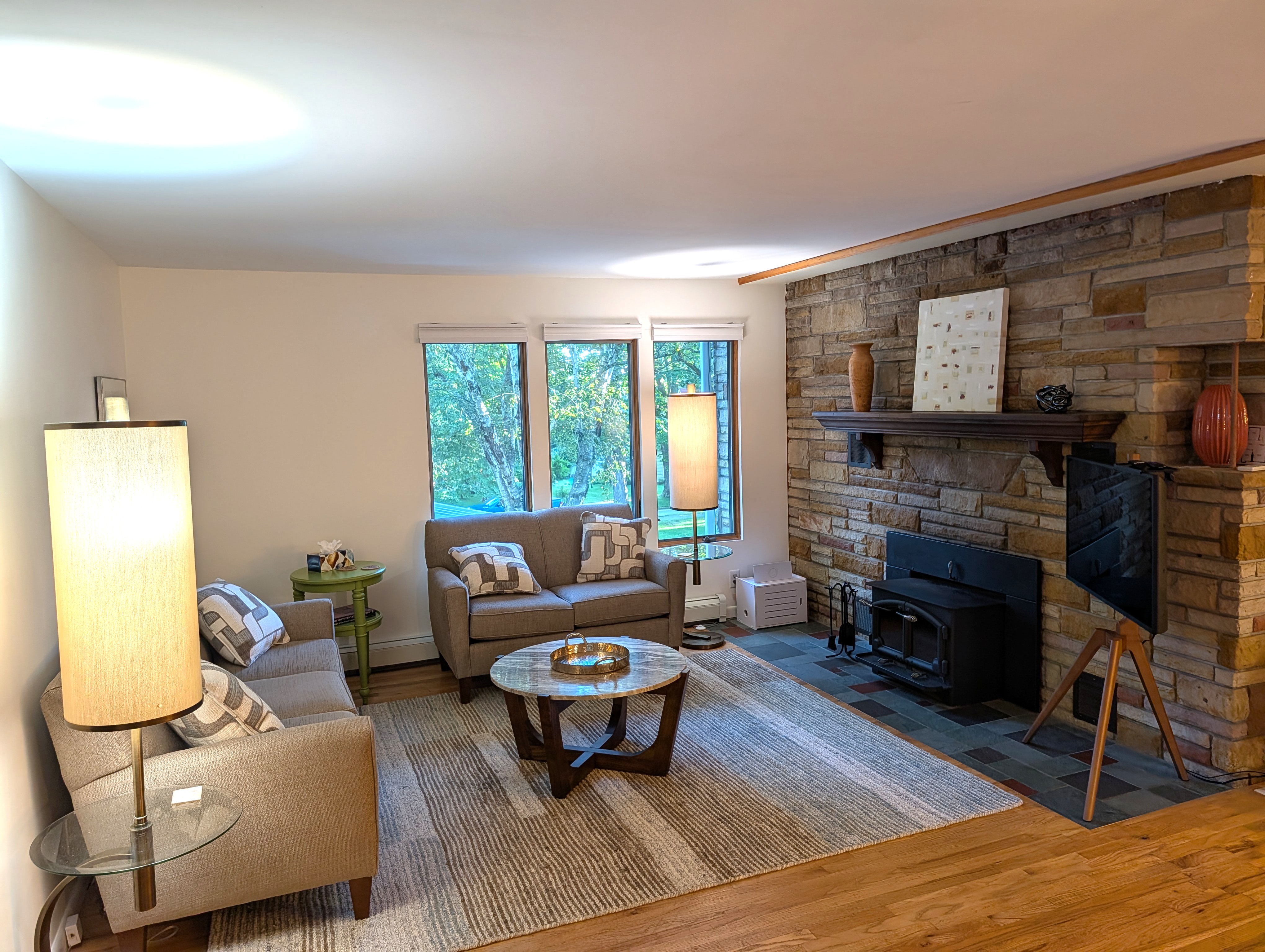 LIVING ROOM #2 (SECOND FLOOR):  Features a sofa, loveseat, coffee table, and television.  (Note that the wood fireplace is not available for guest usage.)