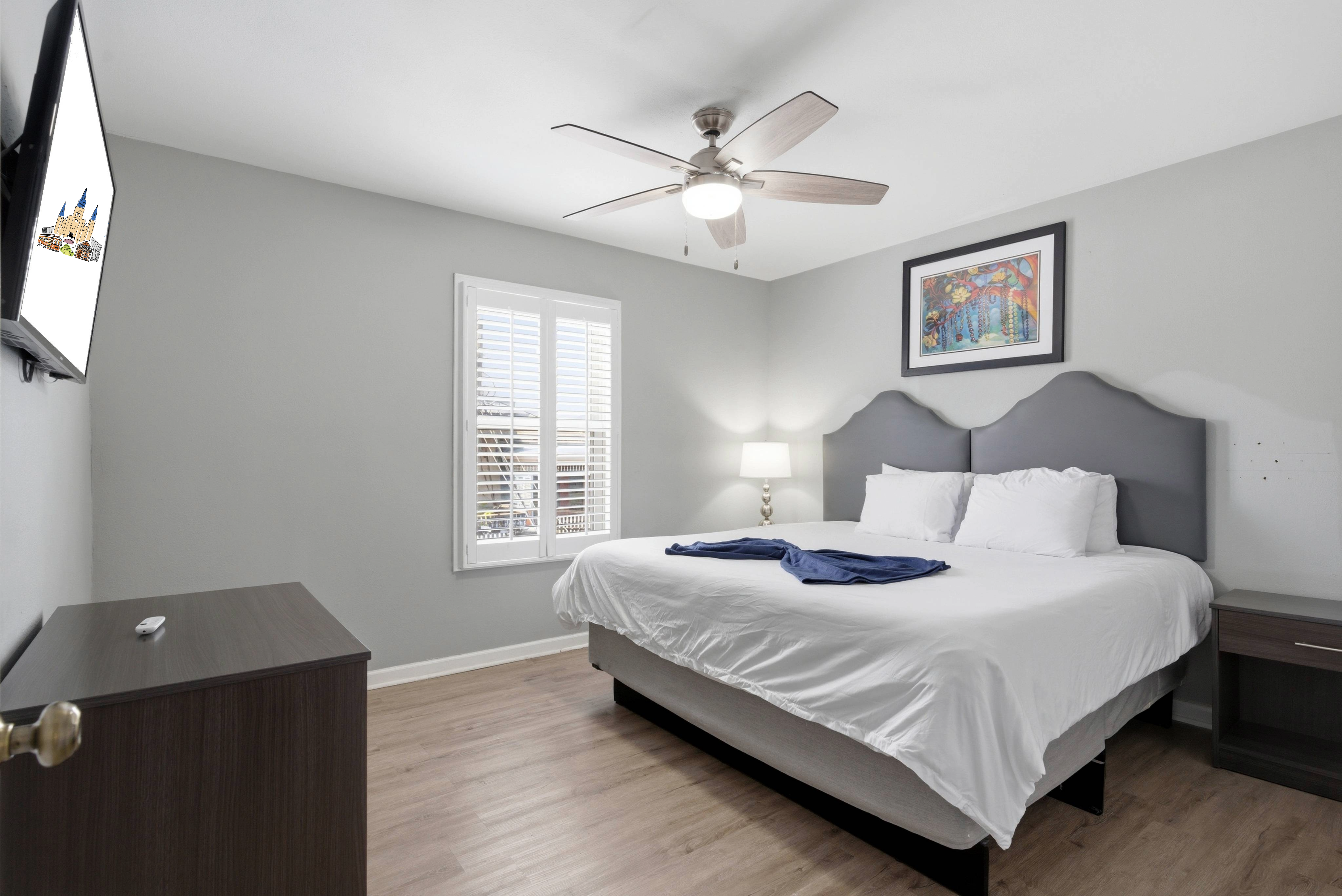 Unit 307-Secondary bedroom with a king bed with calming tones