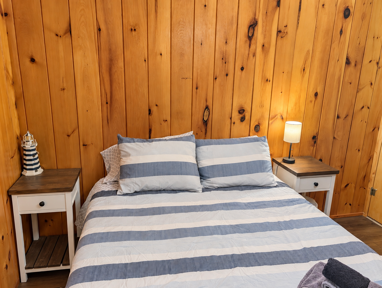 BEDROOM #2:   Features a queen-size bed, nightstands, lamp, dresser, closet, and chair.