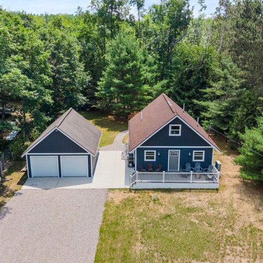 Detached 2-car garage and private drive