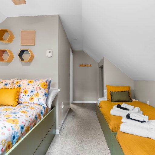 Second upstairs room — full bed plus two twins