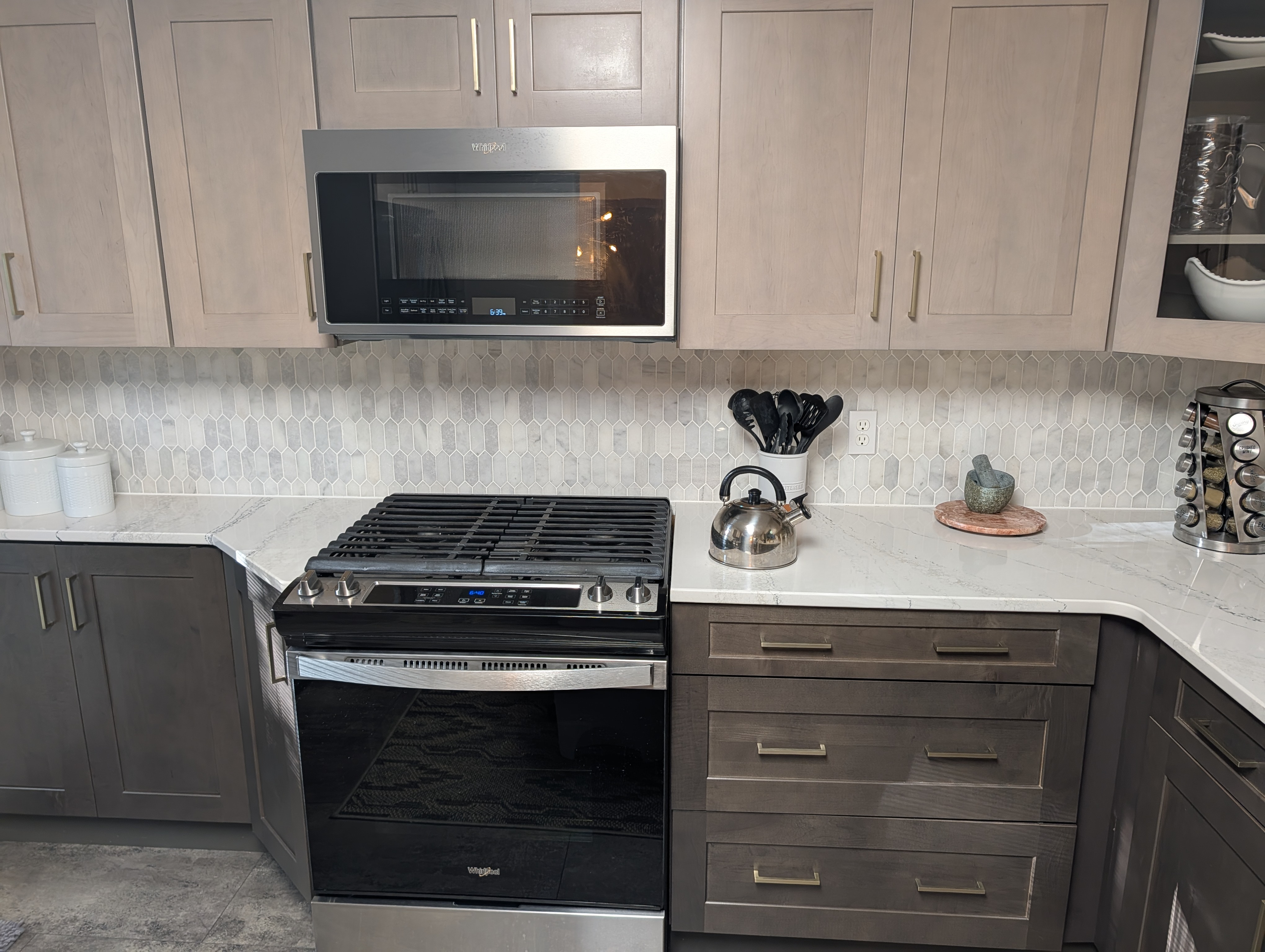 KITCHEN (SECOND FLOOR):  Large modern kitchen with a portal island and all appliances including a dishwasher and microwave.