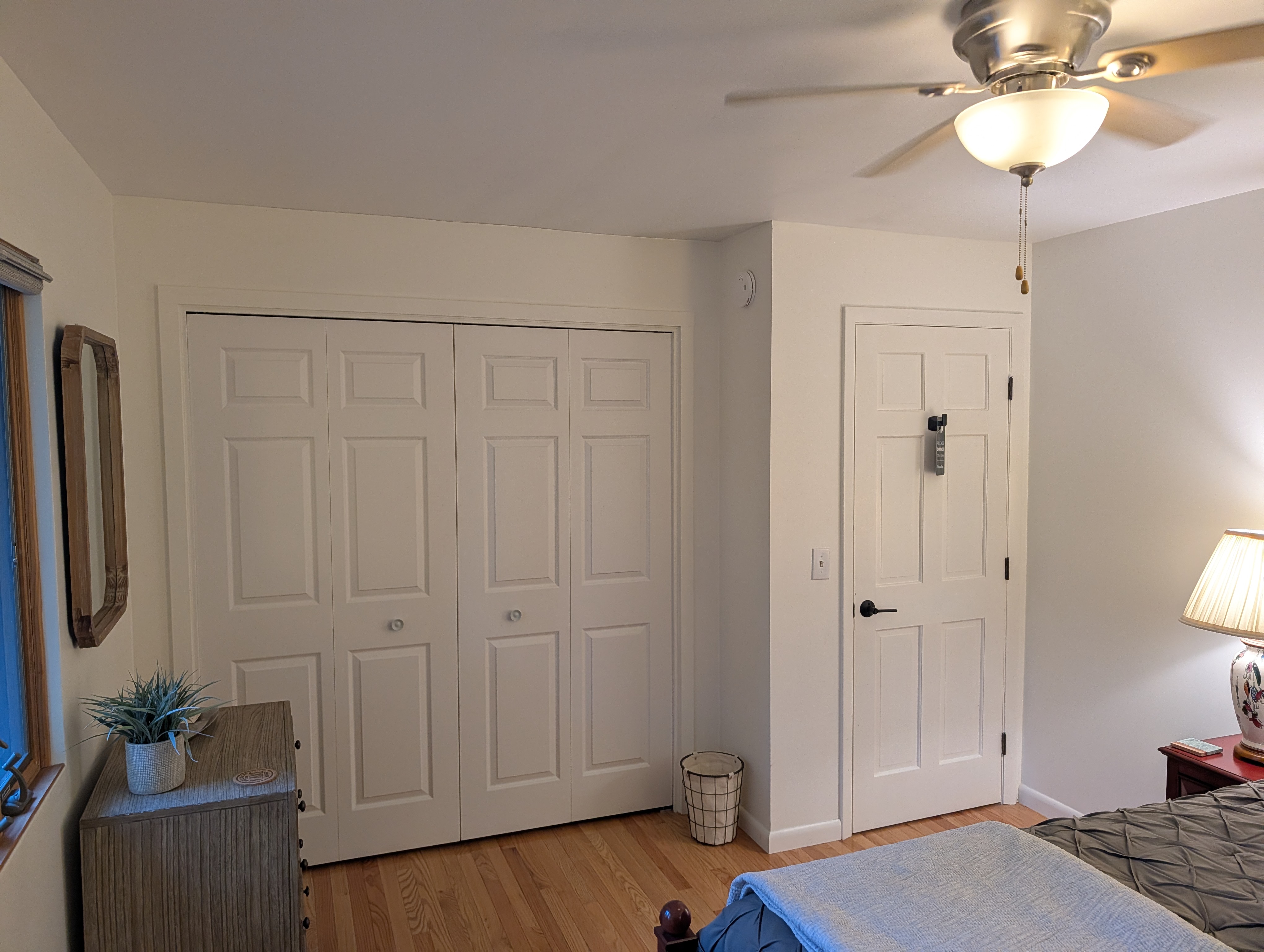 BEDROOM #2 (SECOND FLOOR):  Features a queen-size bed, nightstands, lamps, ceiling fan, dresser, mirror, and closet.