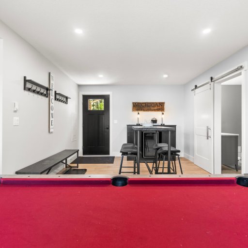 Full-size pool table and bar in the main living room