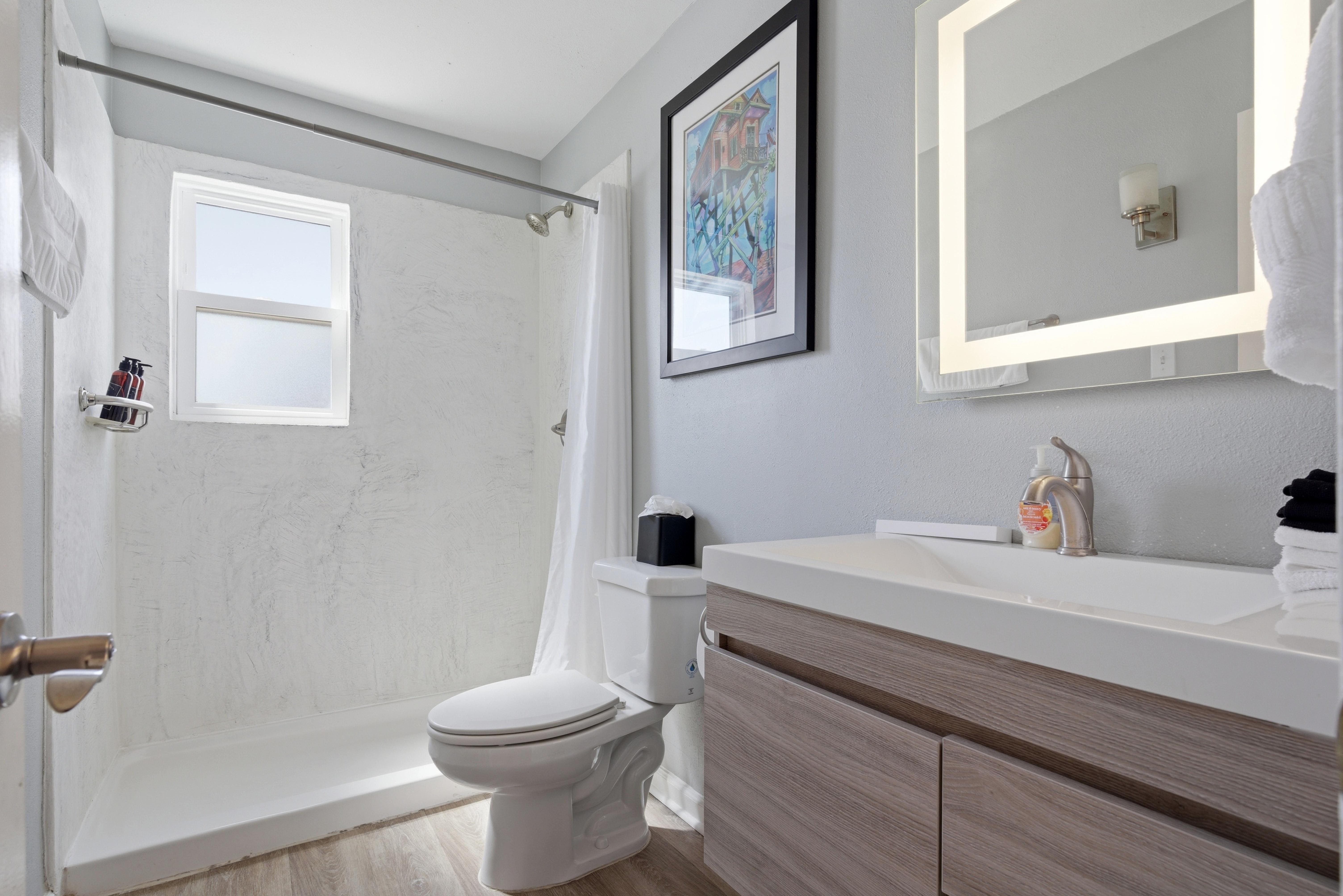 Fresh bathroom space stocked with essentials to refresh & unwind