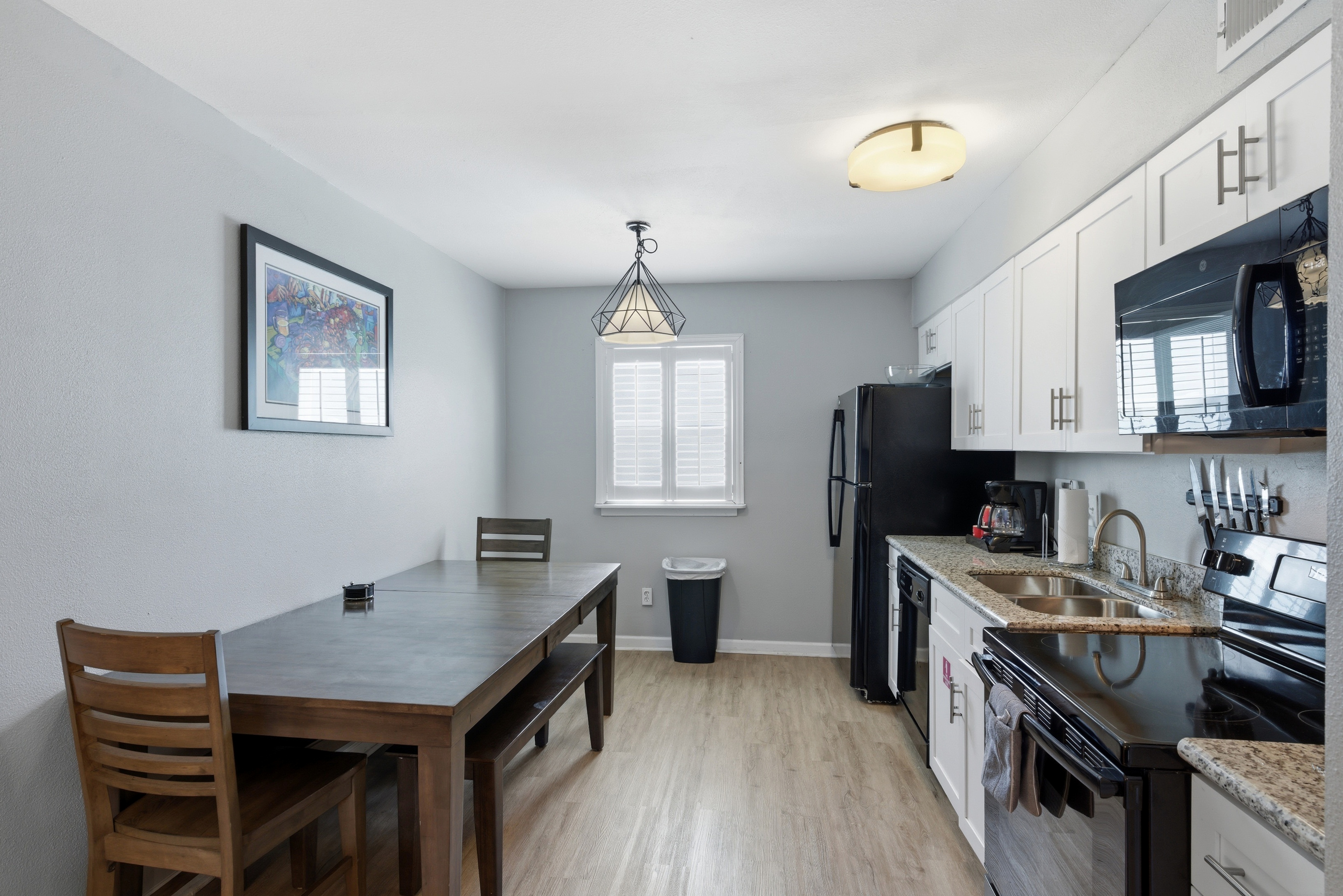 Unit 301-Kitchen area with an elegant look + dining area to bake and bite at the same time!