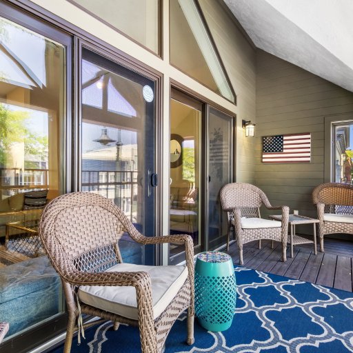 Balcony seating for four, steps from the living room sofas.