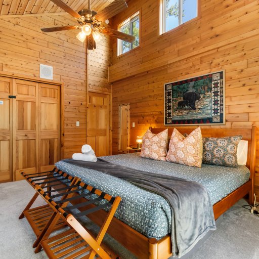 Spacious king primary suite with vaulted ceilings