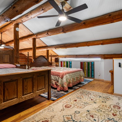 Open loft bedroom with two queen beds