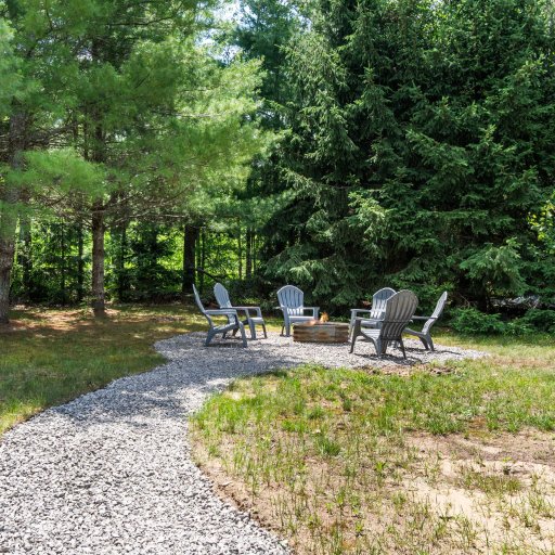 Gravel path to the backyard fire ring