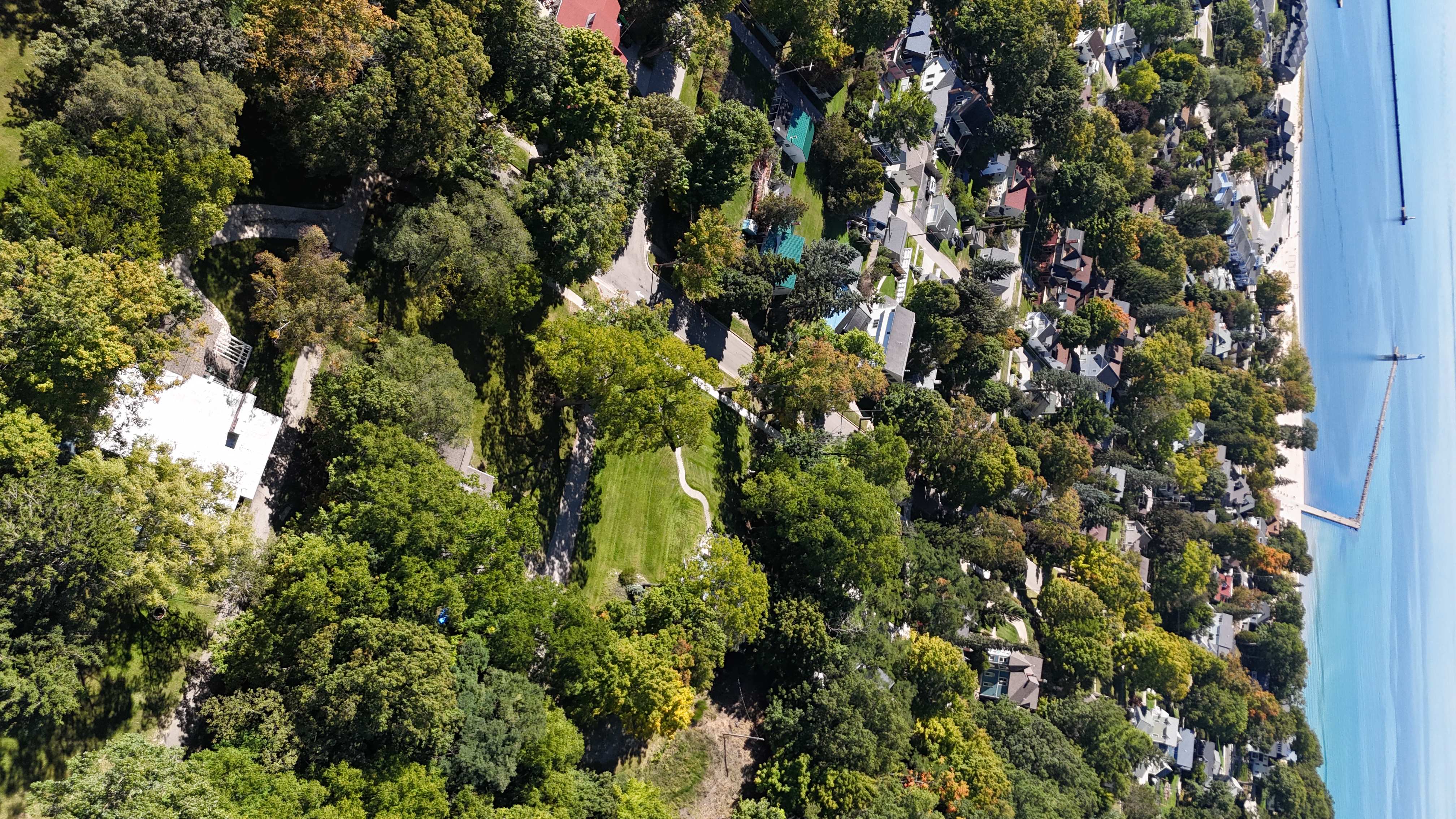 OVERVIEW:  Aerial photo looking southwest from above the property towards downtown Frankfort, Lake Michigan, the Frankfort Pier, and the Frankfort Lighhouse.