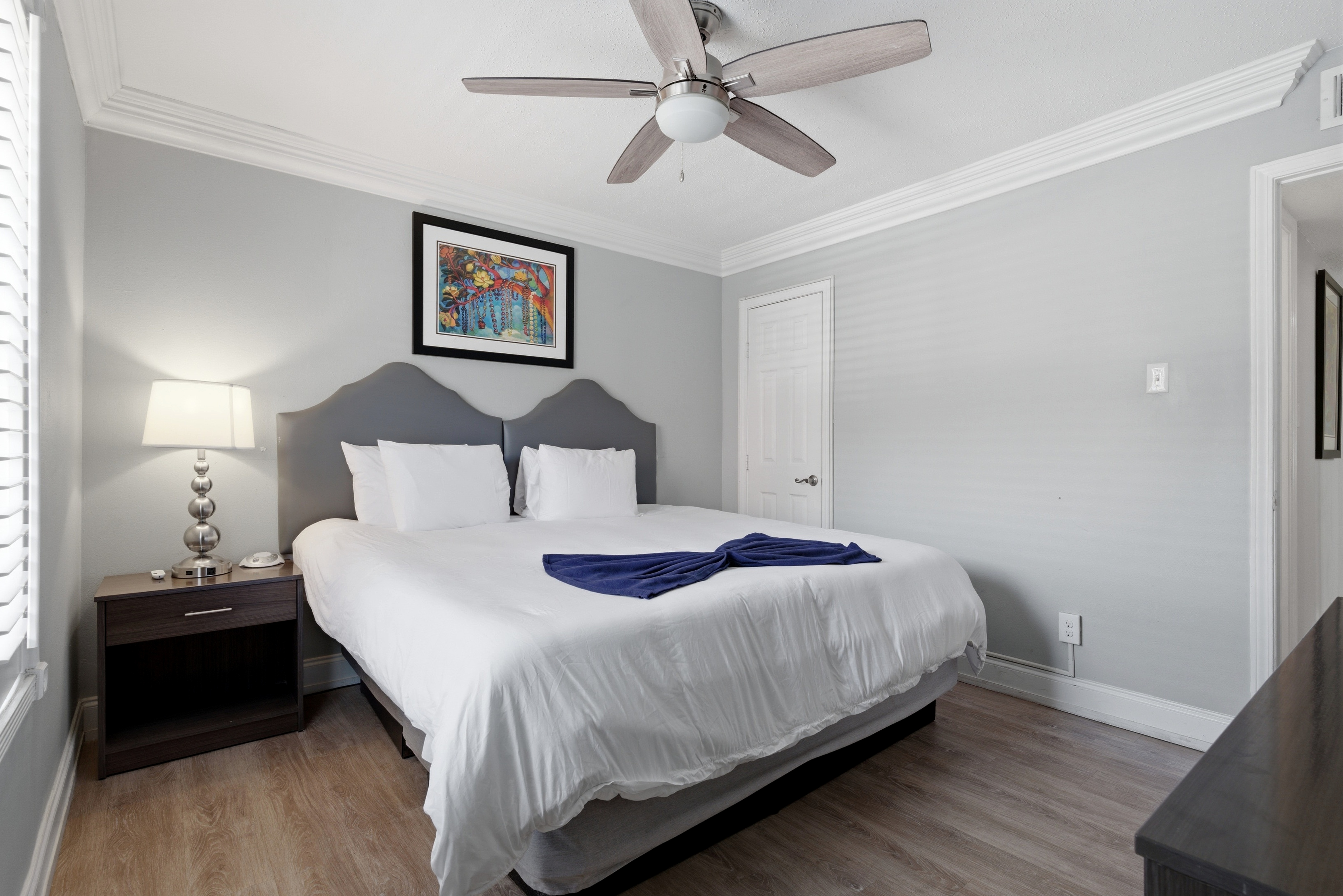 Secondary bedroom with a king bed with calming tones