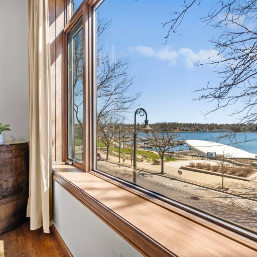 Window seat overlooking Round Lake marina — quiet spot for morning coffee or watching boats pass through downtown.