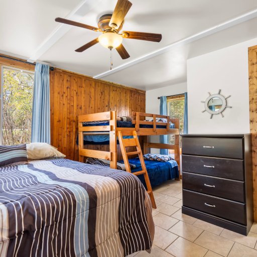 Bedroom with a queen plus twin bunks and its own bathroom - great for families.
