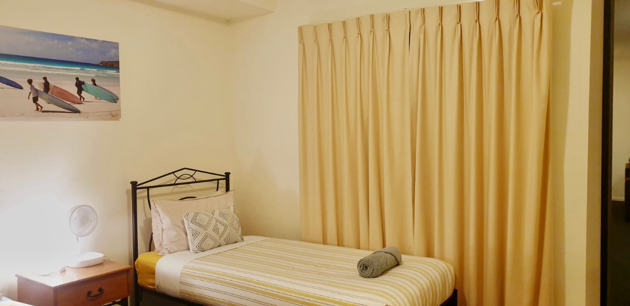 Comfortably accommodates up to five guests with queen, twin single, and sofa bed configuration.