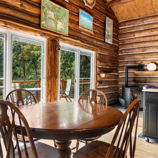 Dining table by the pellet stove and kitchen island