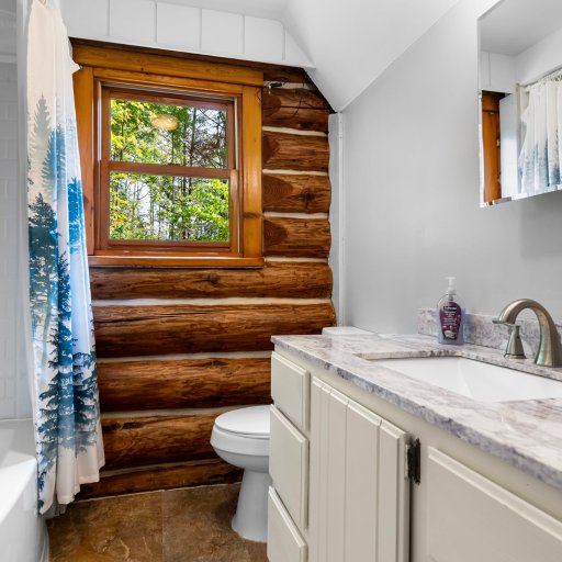Full bathroom with granite vanity
