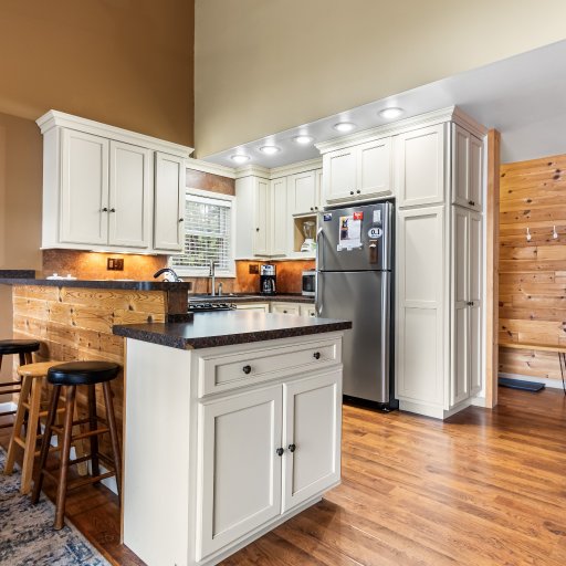 Kitchen island with bar seating, open to the dining table