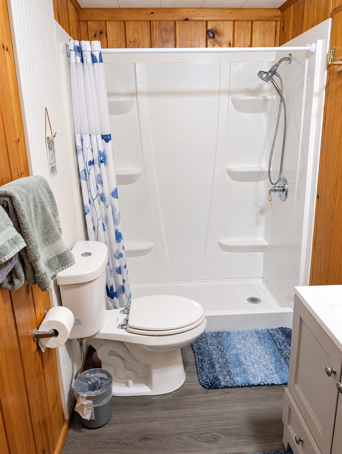BATHROOM:  The home has a full-size bathroom with a walk-in shower.