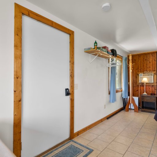 Bright open living and entry with coastal touches - tile floors throughout.