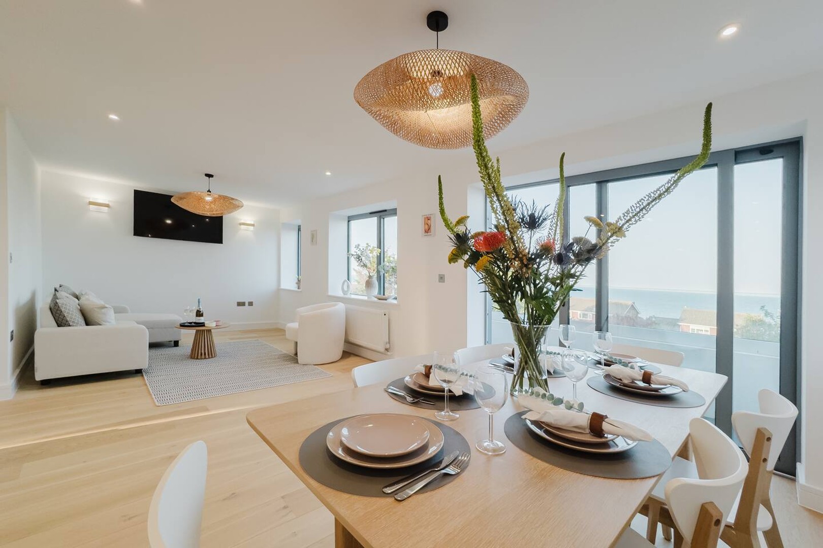 Dining area with a beautiful sea view beyond.