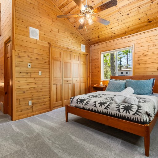 Second bedroom under vaulted cedar ceilings
