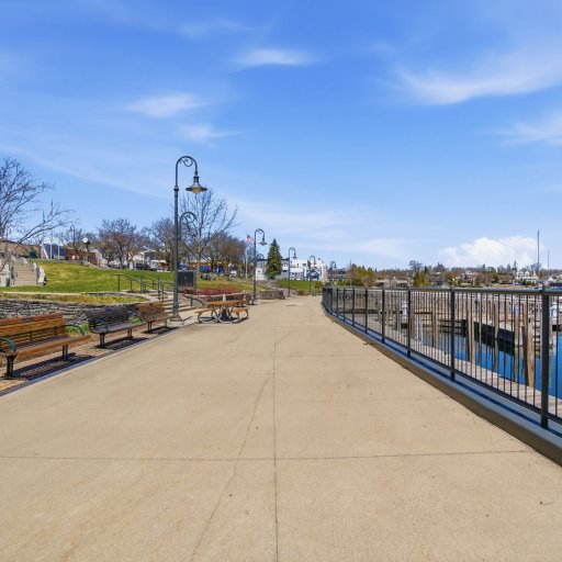 The Charlevoix harbor boardwalk — sunset strolls, ice cream stops, and lighthouse views all in town.