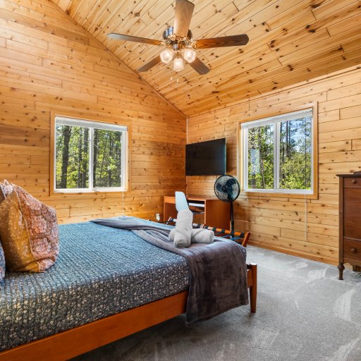 Primary suite with dresser and smart TV