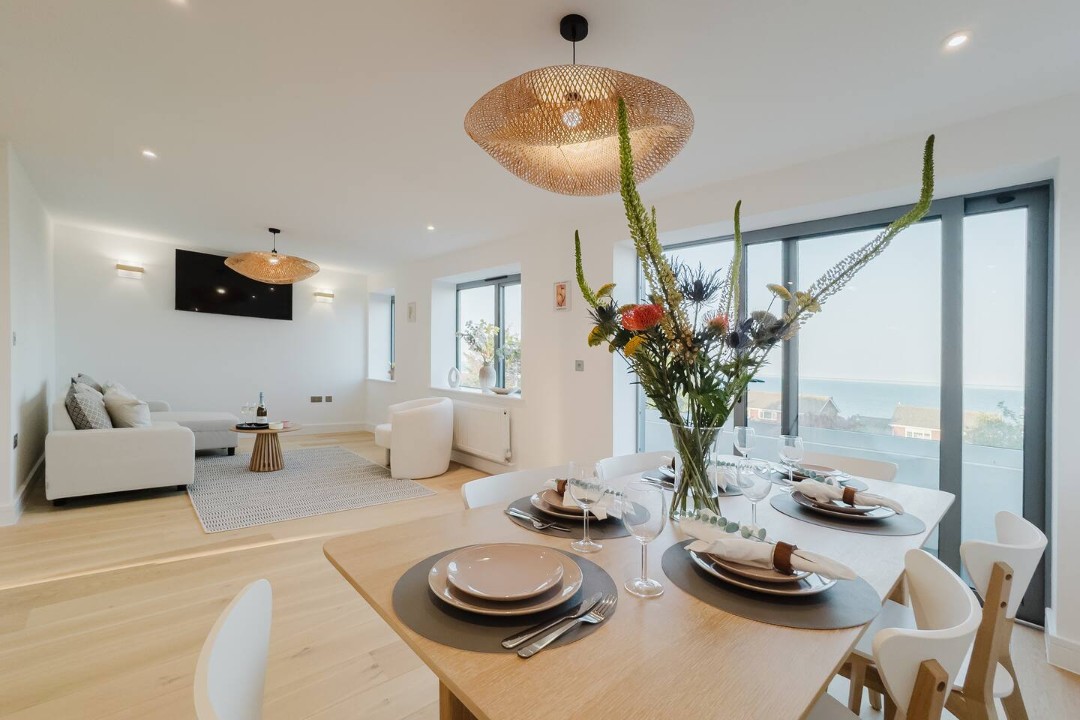 Dining area with a beautiful sea view beyond.