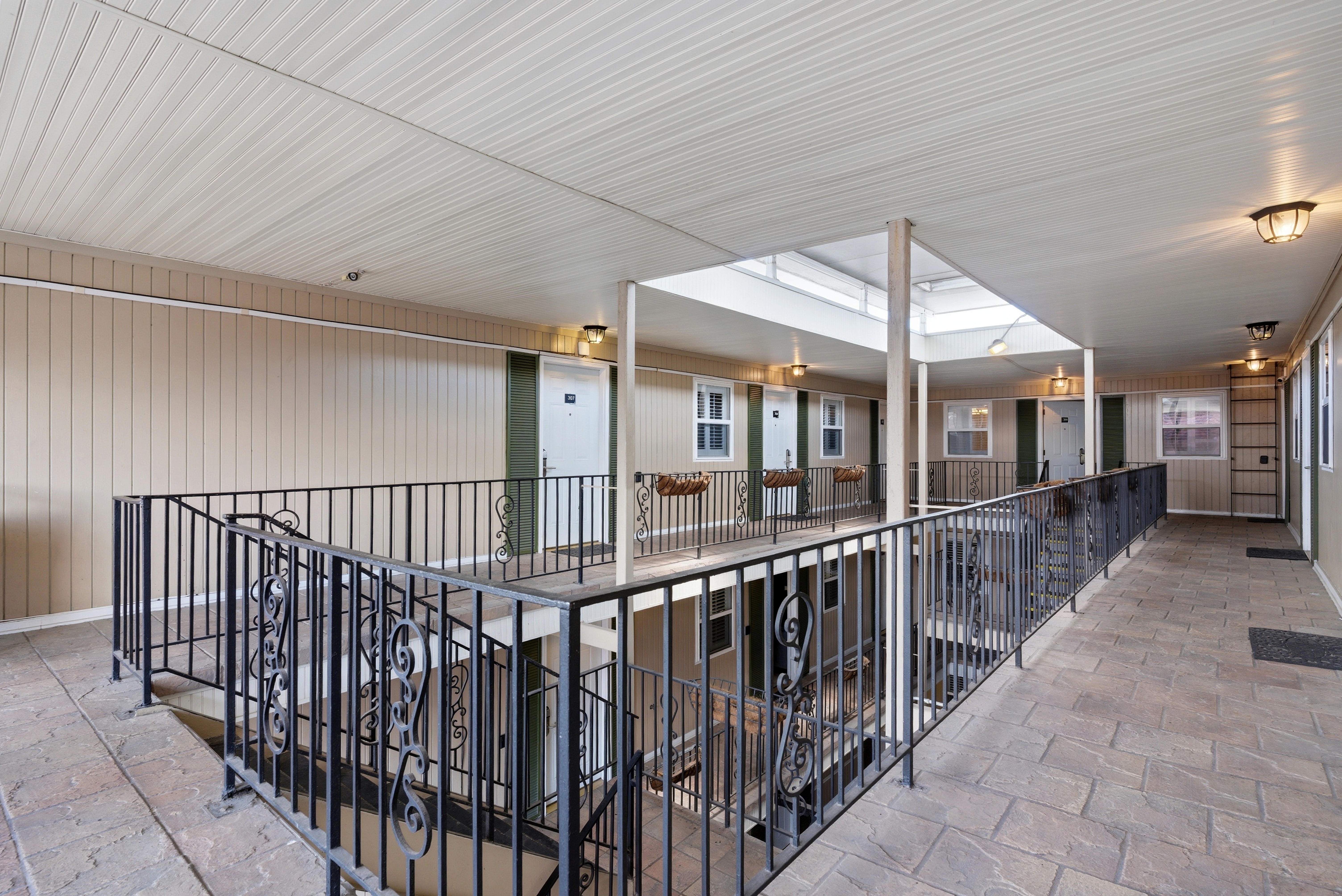 Stairs end and gallery walkway to your suite